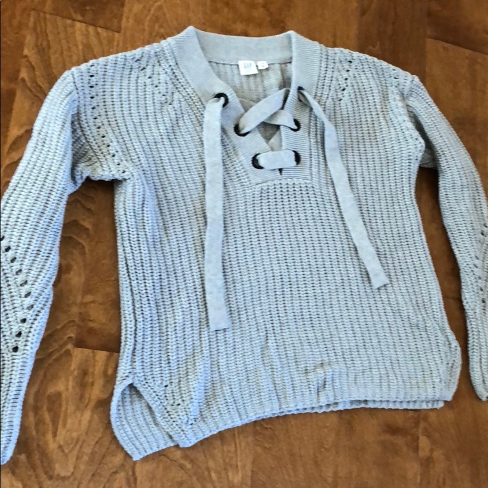 A knitted grey sweater